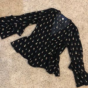 A black blouse with succulents